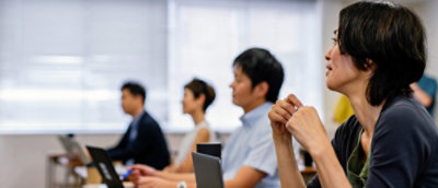 A group of people sitting in a room.
