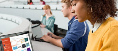 A woman types on her laptop.