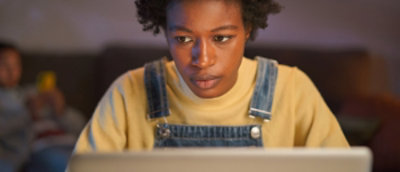 A person looking at a computer screen.