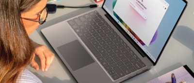 A close-up of a laptop on a desk.