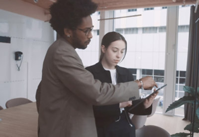 A woman looking at a document.