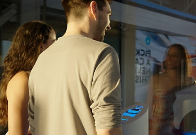 A man and a women looking into a mirror