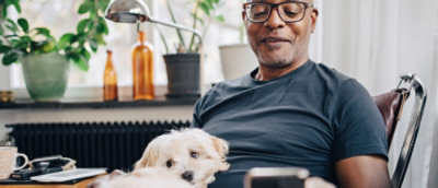 A man holding a dog.