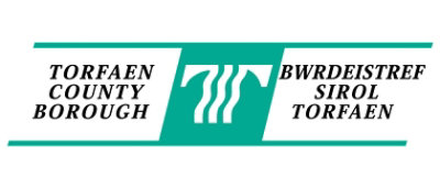 A green and white rectangular sign with the text TORFAEN BWRDEISTREF COUNTY SIROL BOROUGH TORFAEN.
