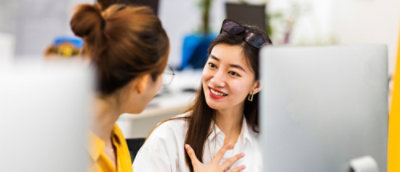 A woman talking to another woman.