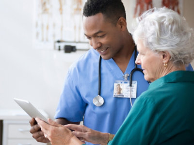 Two people looking at the screen