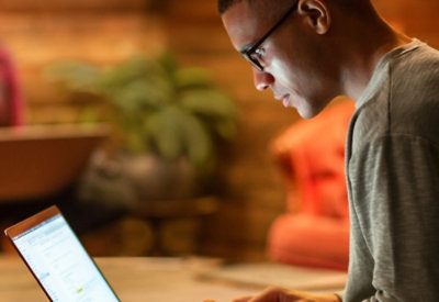 A person working on a laptop.