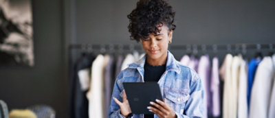 A person holding a tablet.