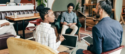 A group of people sitting in chairs.