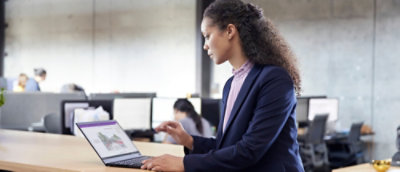 A person in a suit using a laptop.