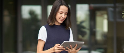 A person holding a tablet.