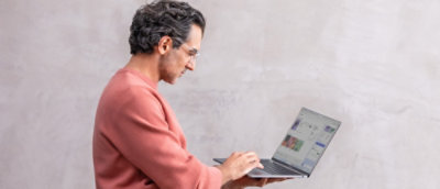 A person typing on a laptop.