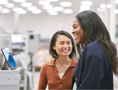 A woman smiling with short hair.