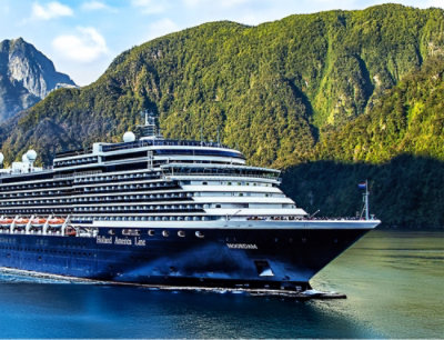 A large cruise ship is floating on the water.