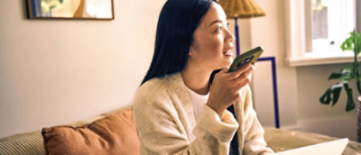 A woman holding a phone.