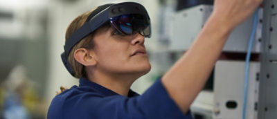 A person wearing a virtual reality headset and looking upwards.