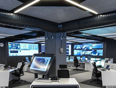 A large room with computers and monitors.