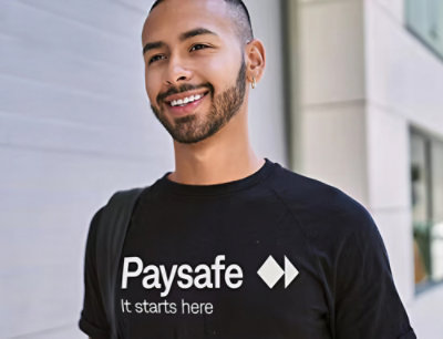 A close-up of a man's face with text Paysafe It starts here visible in the background.