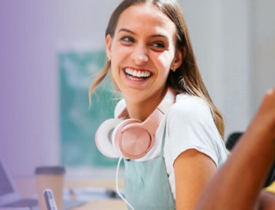 A pair of headphones resting around someone's neck.