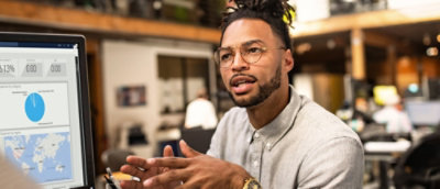 A man with glasses and a beard.