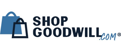 A black and white sign with the text SHOP GOODWILL .COM ®.