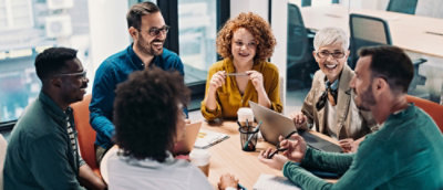 A group of people sitting around a table.
