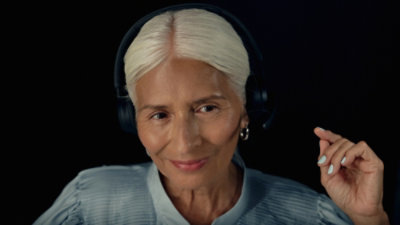 A woman wearing headphones.