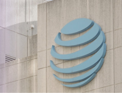 A logo displayed on a white wall.