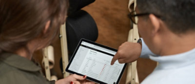 A person holding a tablet.