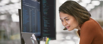 A woman looking at a computer screen.
