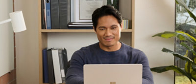 A man smiling and looking at camera.