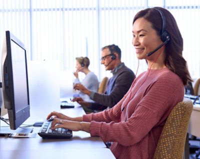 Support agents working with headsets.