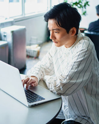 A person typing on a laptop.