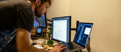 A person typing on a laptop.