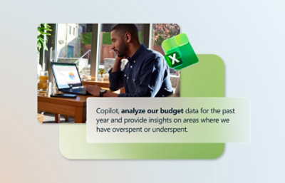 A person sitting at a table with a laptop near two signs, one white with black text and one green and black with a white X.