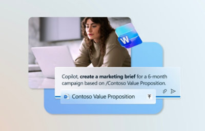 A white paper and screen with text about creating a marketing brief for Contoso Value Proposition.