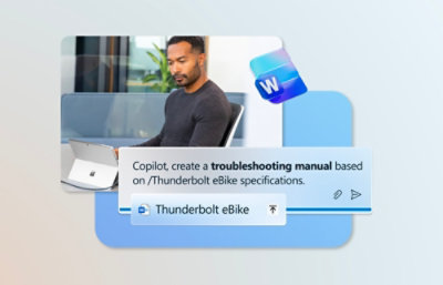 A man sitting in a chair next to a screen displaying text about Thunderbolt eBike specifications.