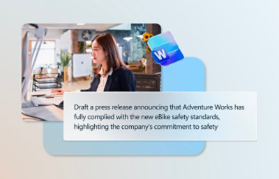 Una mujer con traje redacta en un ordenador un comunicado de prensa sobre el cumplimiento de las nuevas normas de seguridad para bicicletas eléctricas por parte de Adventure Works.