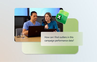 一位男士和一位女士看着笔记本电脑。