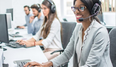 People wearing headphones and working on their systems