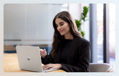 Women working on the laptop and smiling