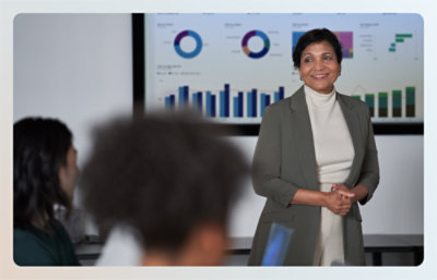 Woman standing in front of white board and smiling