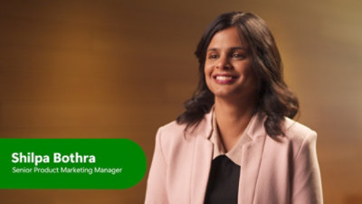 A women with long hairs smiling.