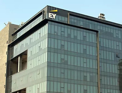 A gray glas building with open sky.