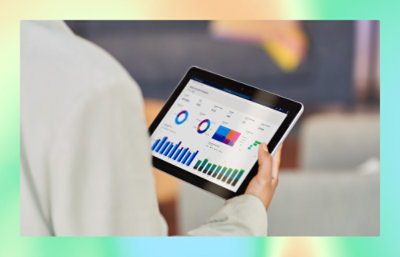 A man holding a tab looking into screen.