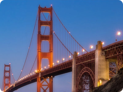 A close-up of a building with the text ABN AMRO and a blue sky with clouds.