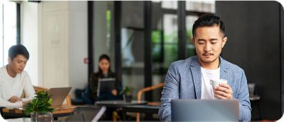 A Man looking into laptop.