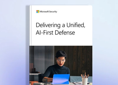 Microsoft Security report cover titled ‘Delivering a Unified, AI‑First Defense’ with a person working on a laptop.