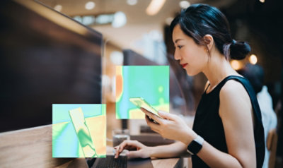 A woman looking on a laptop.