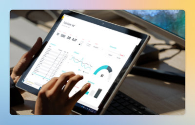 A hand touching a tablet screen.